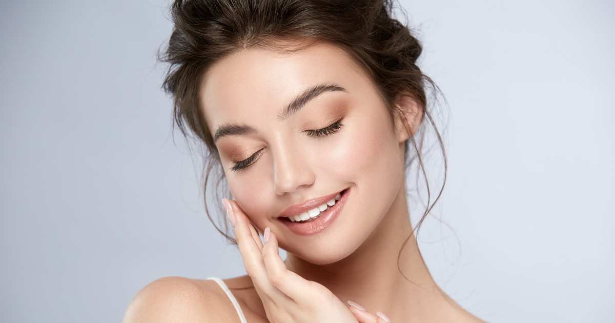 Woman with glowing skin smiling after Mermaid Facial treatment In Nevada City, CA